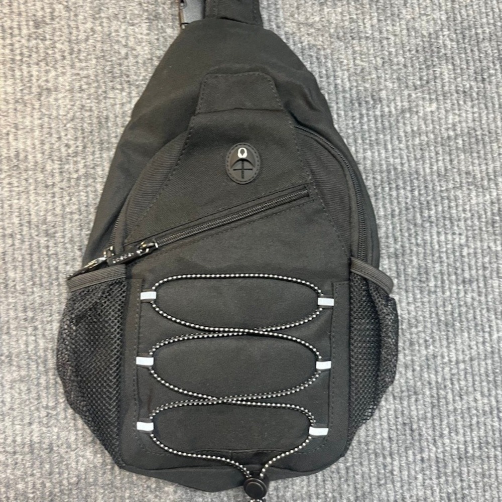 Black Sling Backpack Crossbody Shoulder Bag with Bungee Cord and Headphone Port - Picture 3 of 7
